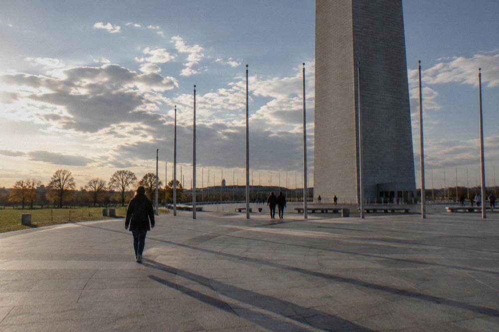 The circle of flags surrounding the Washington Monument on an open plaza