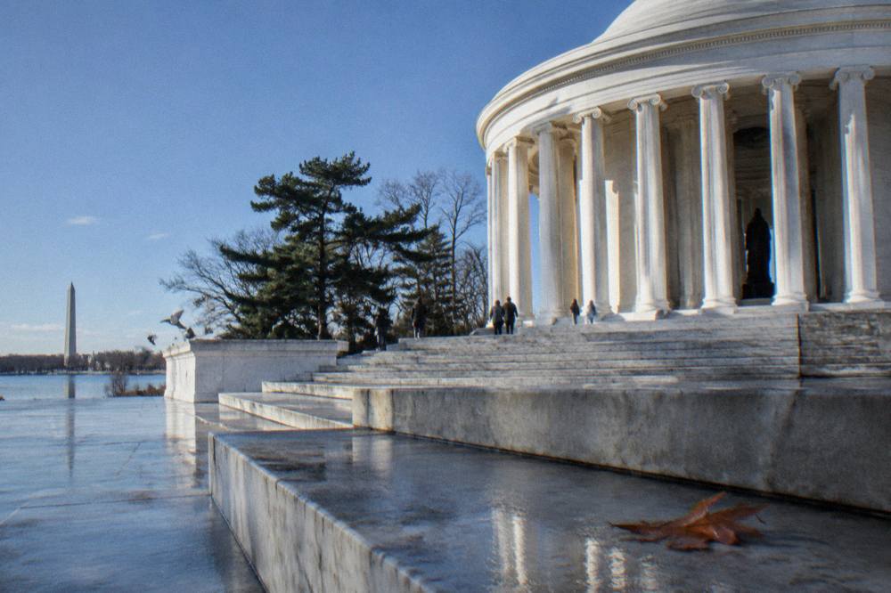 Stone steps and columns of a memorial on the National Mall under open sky