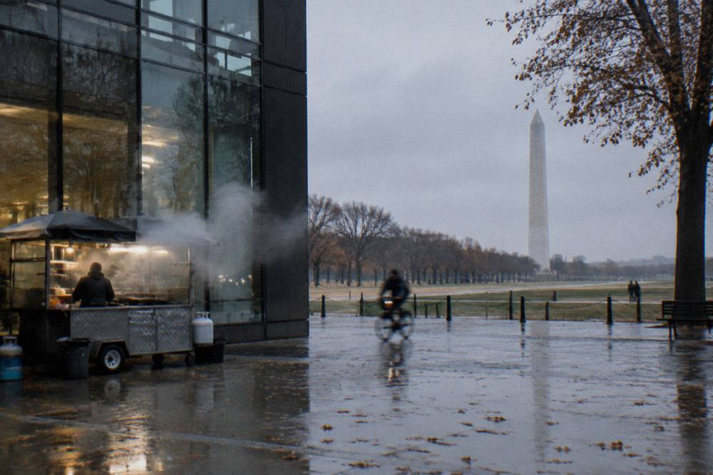 Exterior of a modern museum building on a Washington DC street corner with large glass panels