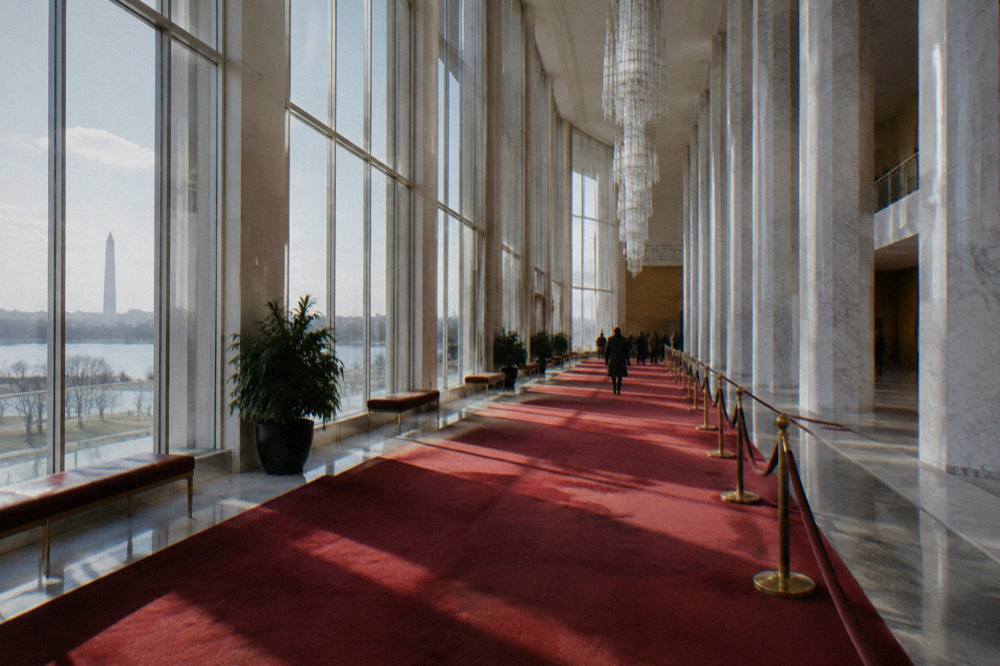 The Grand Foyer of the Kennedy Center with its tall columns and hanging chandeliers