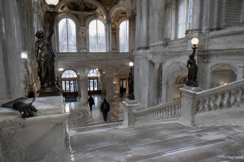 Grand staircase and arched windows inside the Library of Congress building