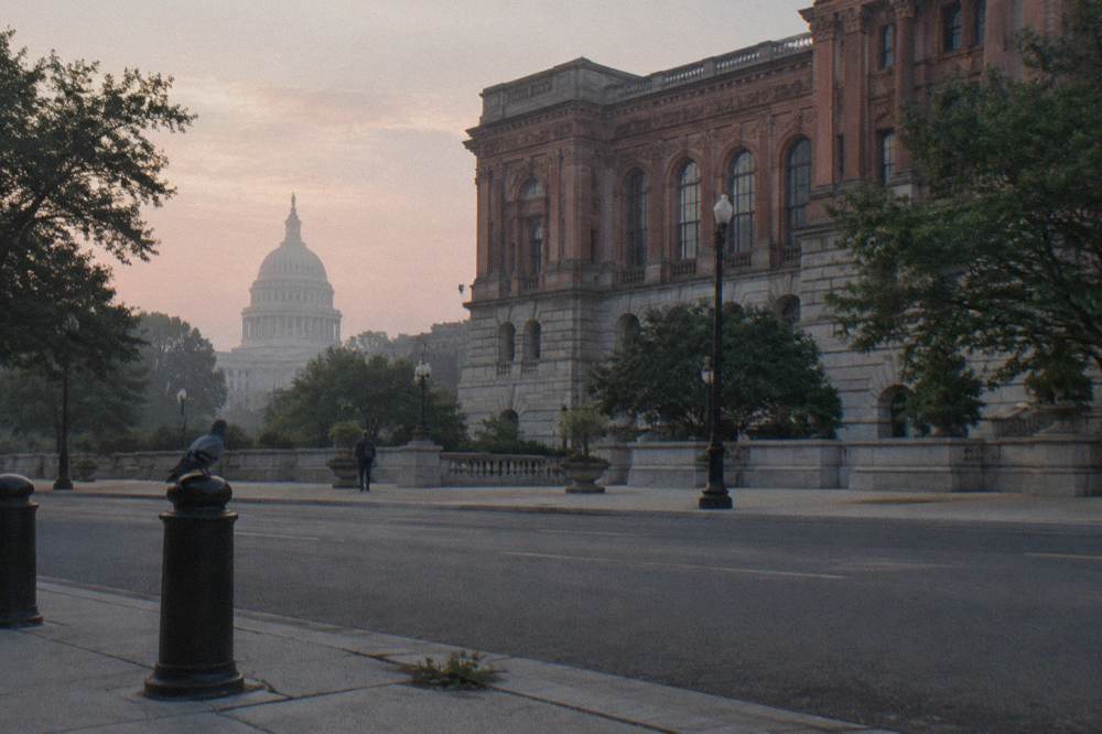 Exterior view of the Library of Congress building with the United States Capitol dome behind it