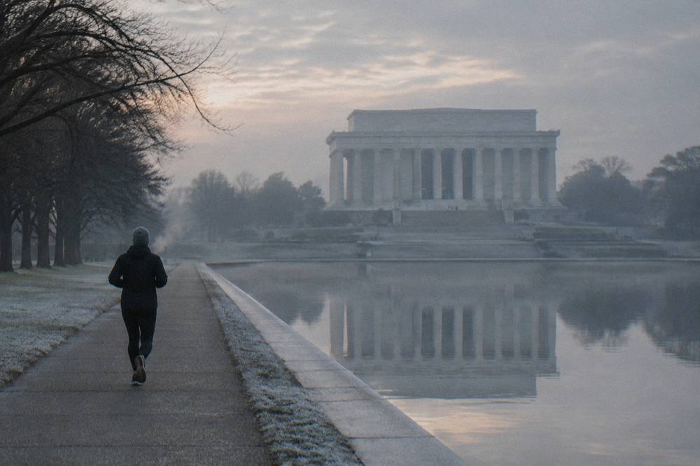 Granite steps and columns of the Lincoln Memorial seen from the reflecting pool path