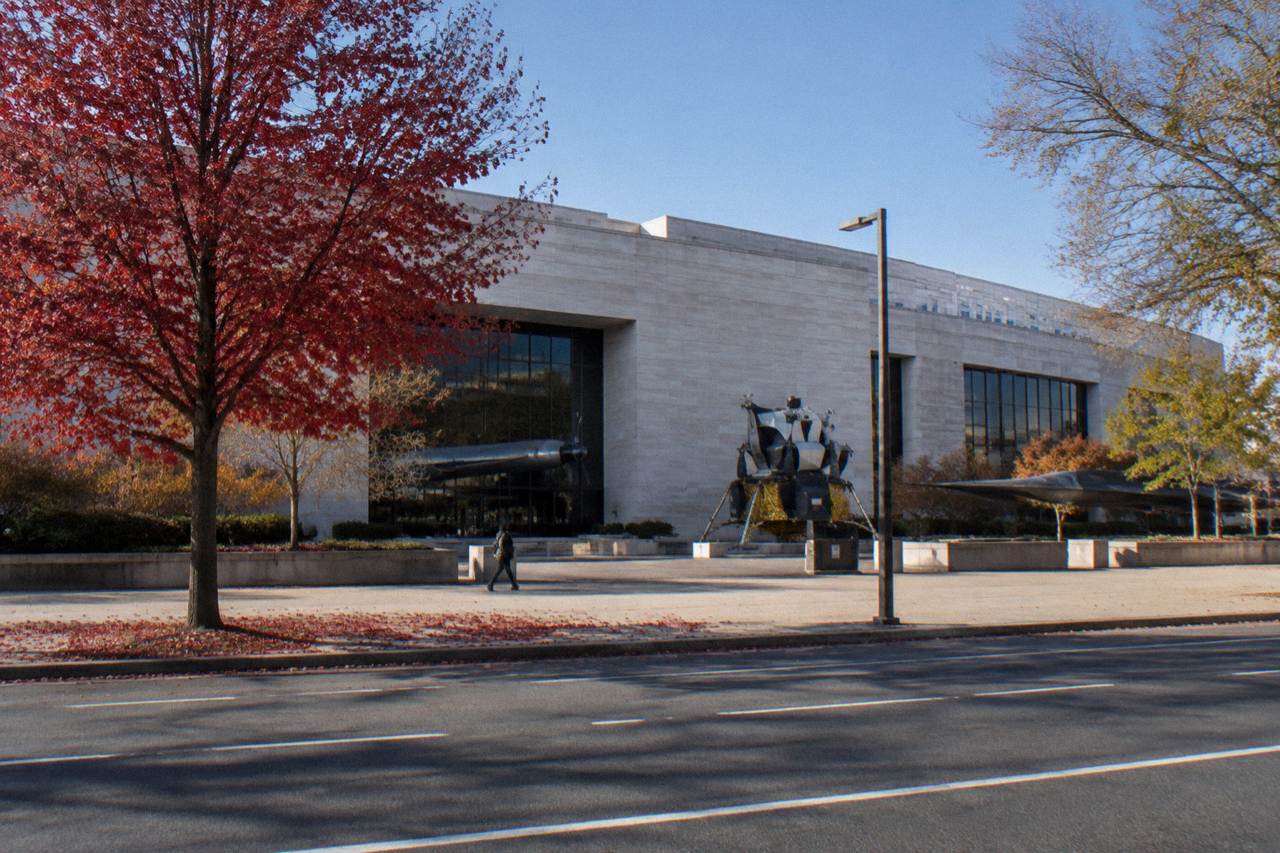 The Smithsonian National Air and Space Museum building on the National Mall under a clear sky