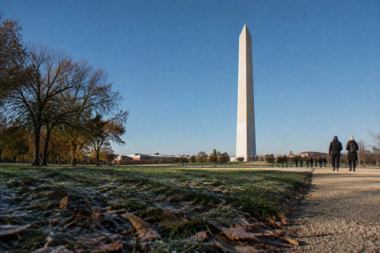 Washington Monument obelisk rising above the National Mall with clear sky