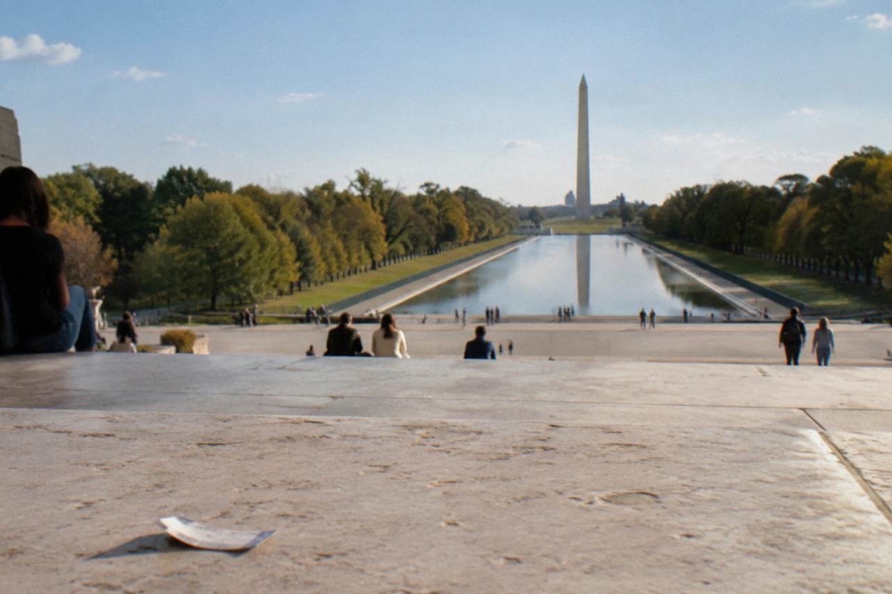 Sunlit view of the Lincoln Memorial and Reflecting Pool on the National Mall