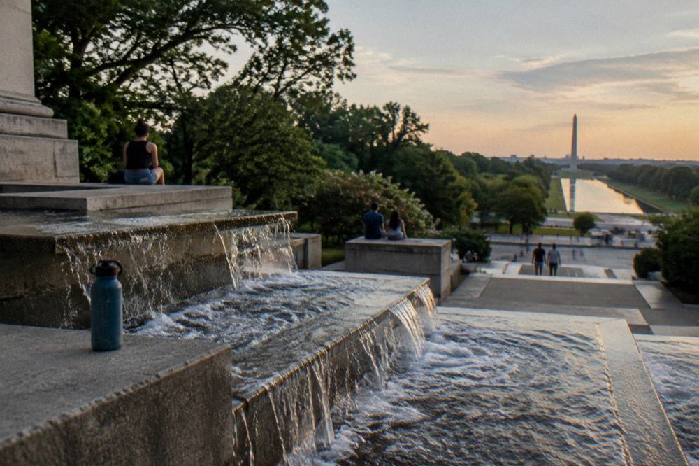 Stone steps and cascading fountain at Meridian Hill Park with the Washington Monument visible in the distance