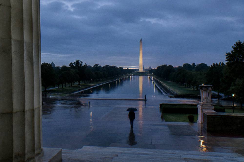 Washington Monument and memorial corridor at dusk seen from the Capitol end of the Mall