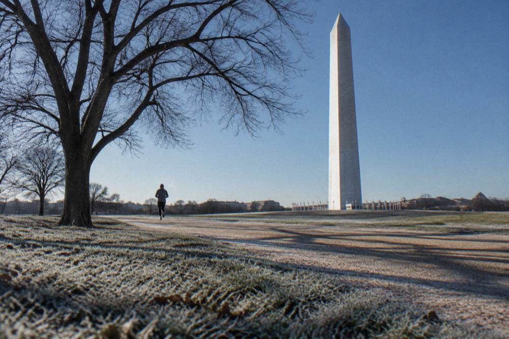 The Washington Monument seen from the National Mall lawn on a clear morning