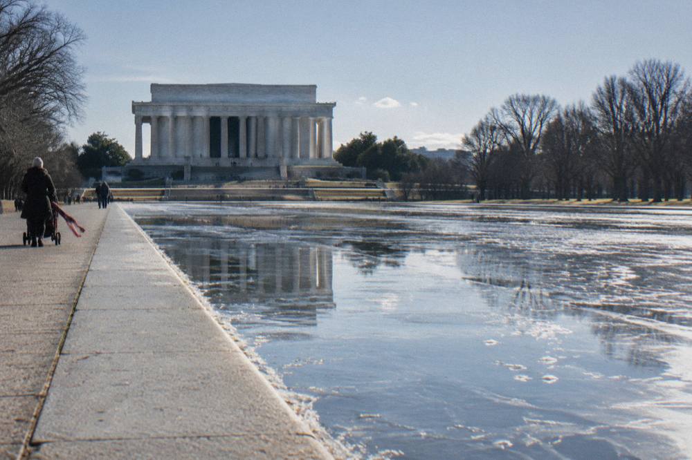 The Lincoln Memorial columns seen from the reflecting pool at midday