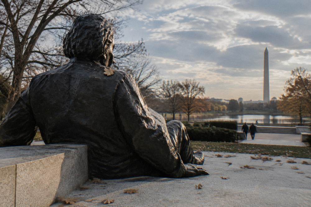 The Albert Einstein Memorial statue with the metal figure seated on its stone bench