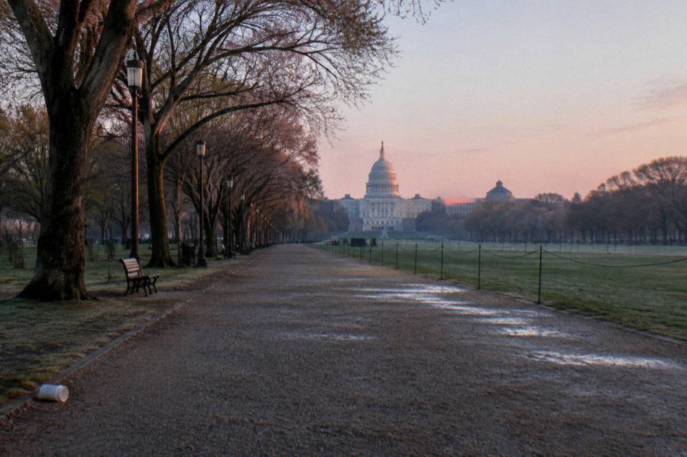 Empty Mall pathway in early morning light with the Capitol building ahead